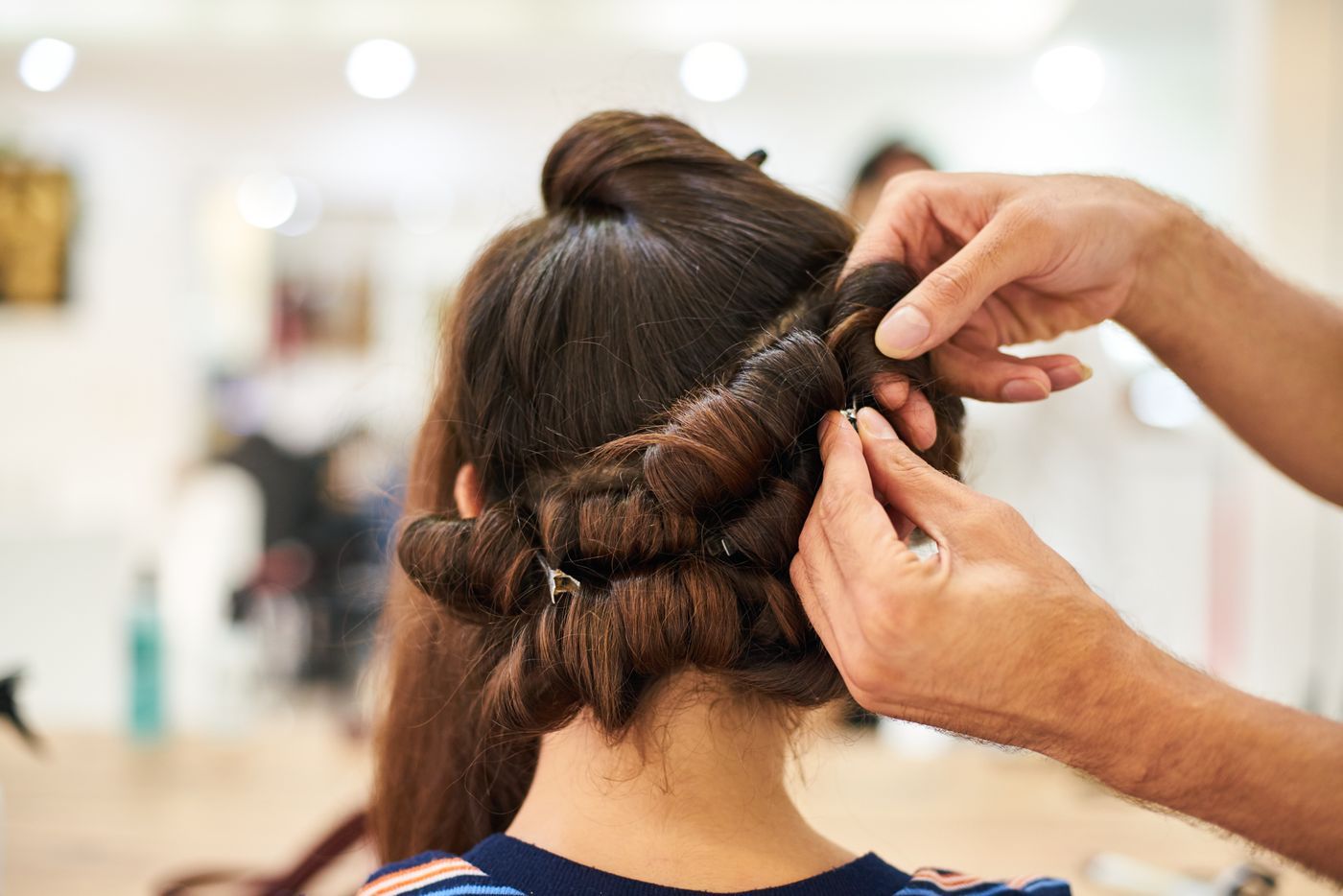 Hair being twisted into an updo